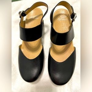 Dansko black cushioned clog with back strap. 2 inch heel. Lots of great details